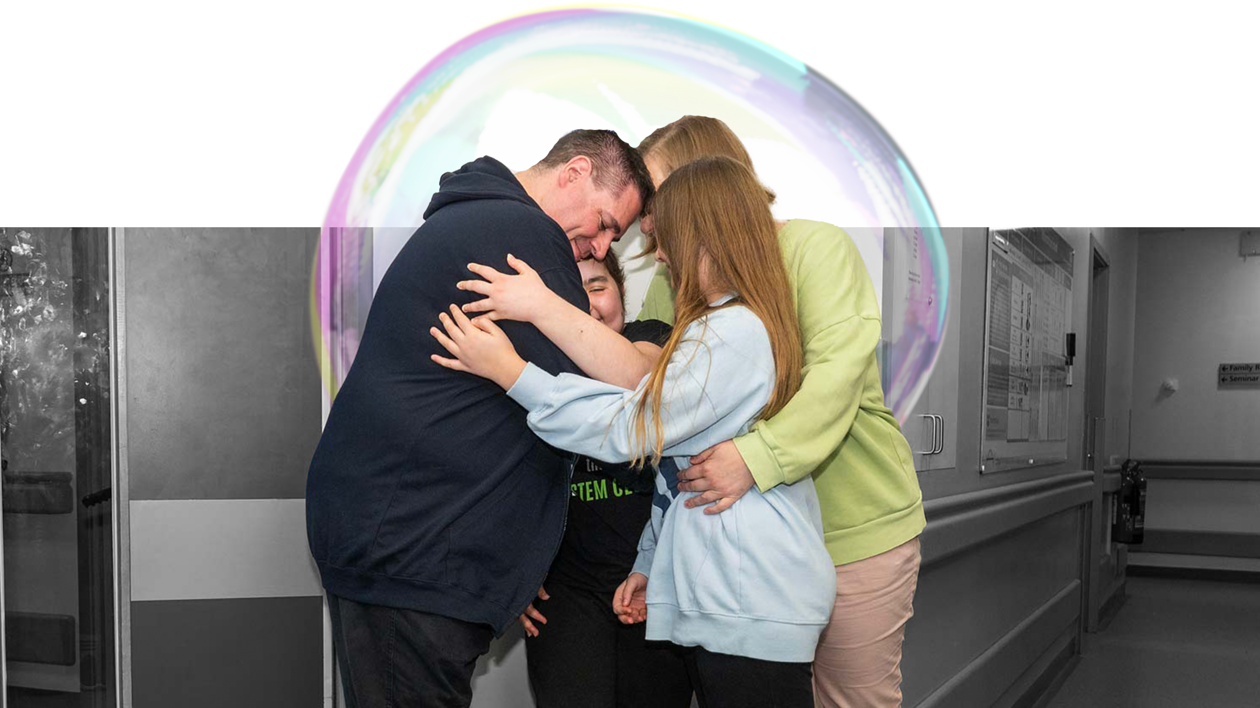 Lexi and her family hugging after discharge
