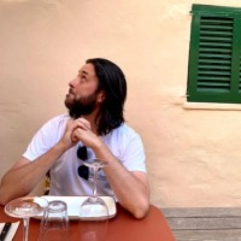 Dan looks left into the distance